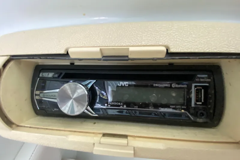 Slide: The Image of 1997 Baja 302 Boss boat with JVC stereo system, featuring Bluetooth and USB connectivity. - 18
