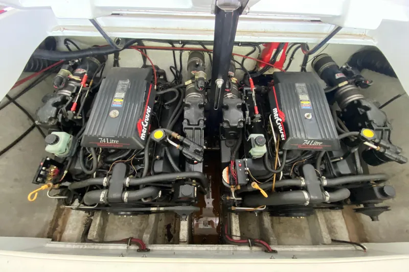 Slide: The Image of Twin MerCruiser 7.4L engines in a 1997 Baja 302 Boss boat engine compartment. - 19
