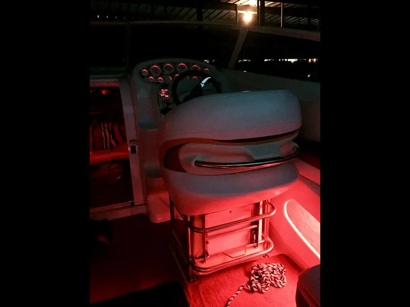 Slide: The Image of 1997 Baja 302 BOSS boat interior with red ambient lighting. - 5