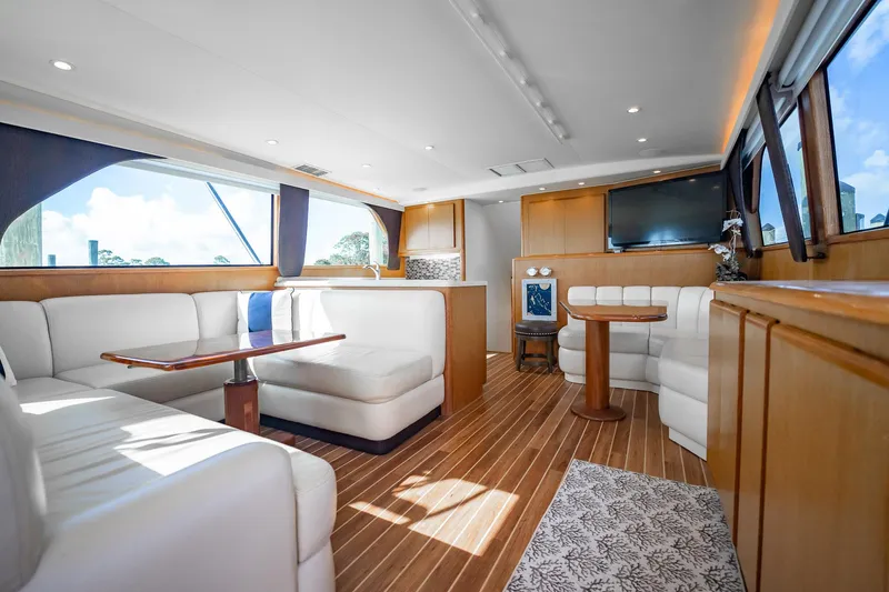 Slide: The Image of Luxurious interior of 2000 Viking 50 Conv Sport Fisher yacht with elegant seating and wood flooring. - 10