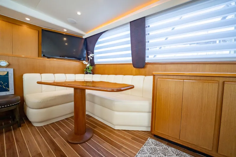 Slide: The Image of Luxurious interior of 2000 Viking 50 Conv Sport Fisher yacht with elegant seating and wood finishes. - 15