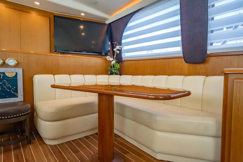 Slide: The Image of Luxurious interior of 2000 Viking 50 Conv Sport Fisher yacht with elegant seating and table. - 16