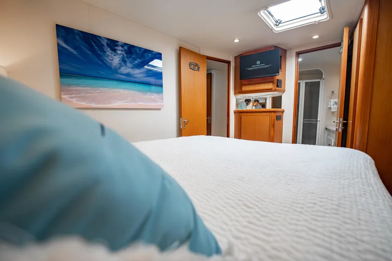 Slide: The Image of Luxurious cabin interior of 2000 Viking 50 Conv Sport Fisher yacht with beach artwork. - 25