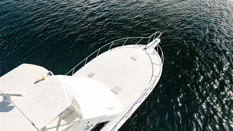 Slide: The Image of Aerial view of 2000 Viking 50 Conv Sport Fisher boat on water. - 36