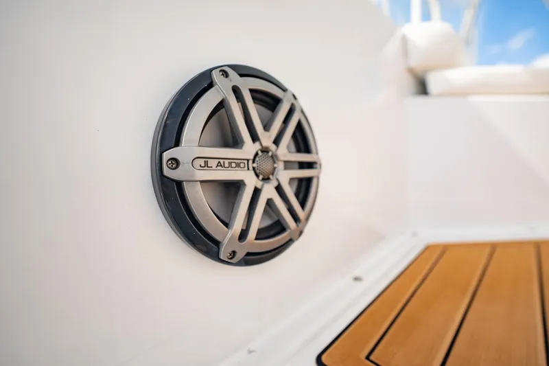 Slide: The Image of JL Audio speaker on 2000 Viking 50 Conv Sport Fisher boat with teak flooring. - 40