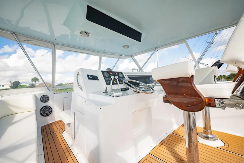 Slide: The Image of Helm of 2000 Viking 50 Conv Sport Fisher with modern controls and seating. - 41