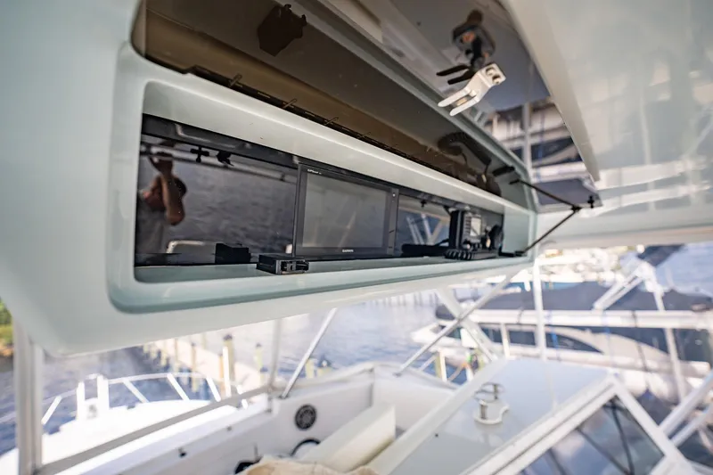 Slide: The Image of Open electronics compartment on 2000 Viking 50 Conv Sport Fisher boat. - 47