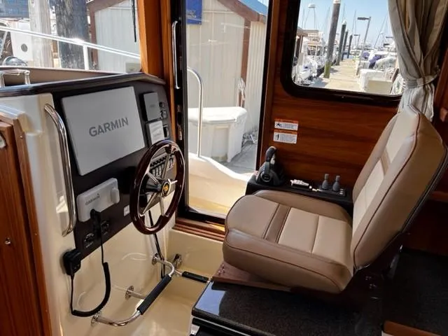Slide: The Image of Interior of 2022 Ranger Tugs R-31 CB boat with Garmin navigation system. - 18