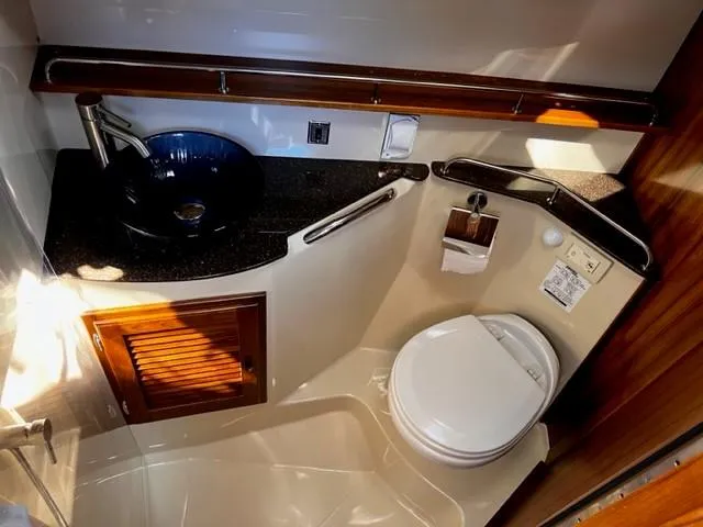Slide: The Image of 2022 Ranger Tugs R-31 CB bathroom with modern sink and toilet. - 23