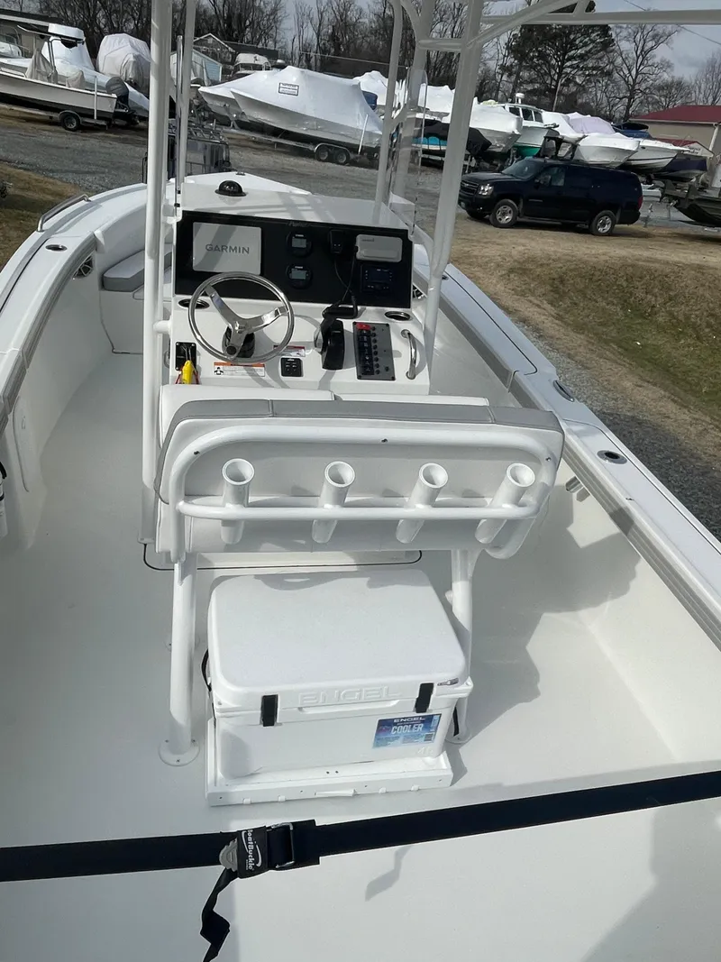 Slide: The Image of 2025 Parker 2100 Special Edition boat interior with console and seating. - 4