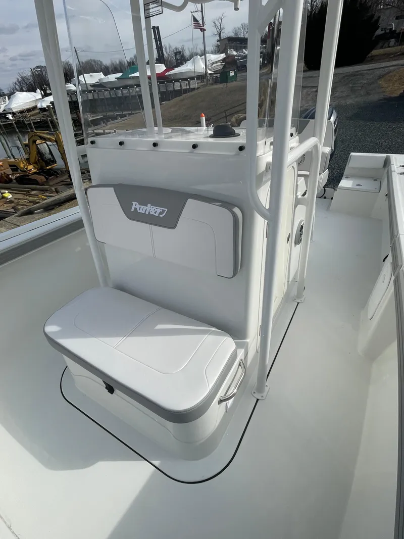 Slide: The Image of 2025 Parker 2100 Special Edition boat interior with seating and console. - 7