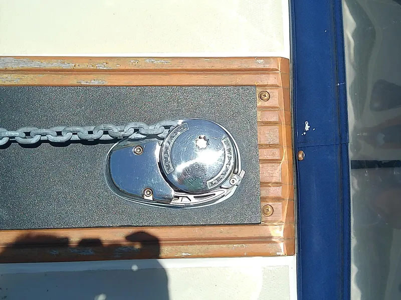 Slide: The Image of Anchor windlass on 1985 Robalo 2520 Center Console boat deck. - 17