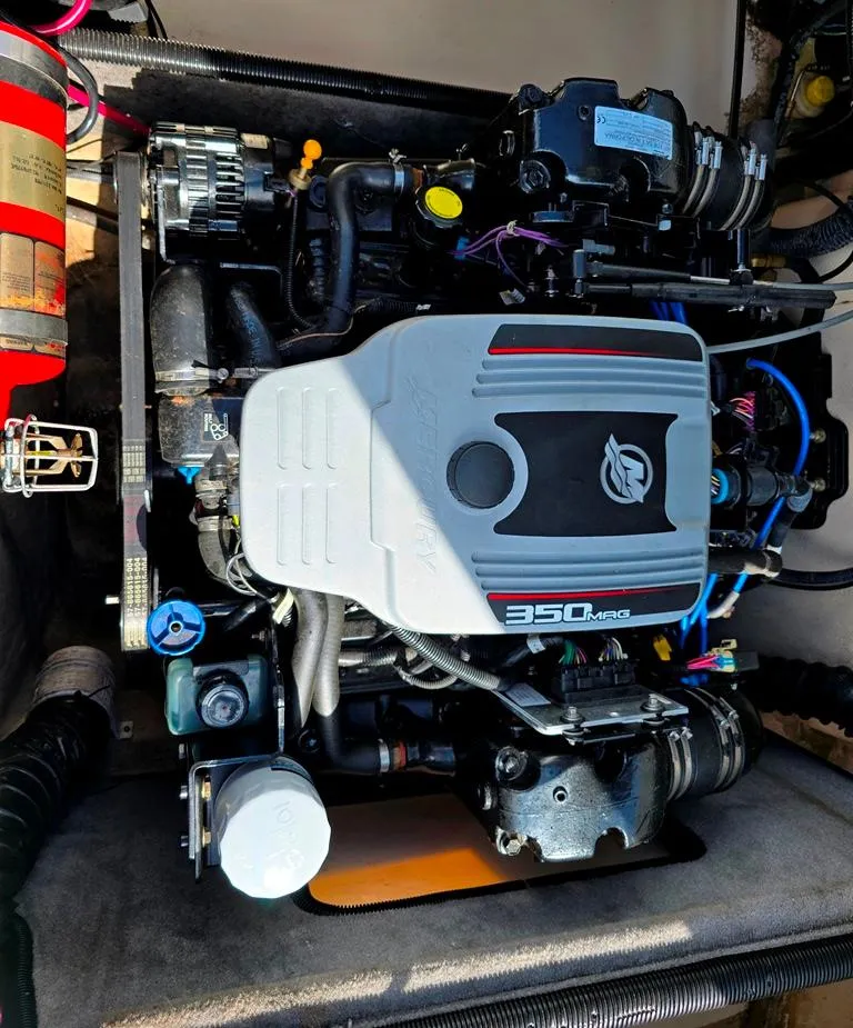 Slide: The Image of Engine compartment of a 2008 Bryant 246 BR boat with a 350 MAG engine. - 10