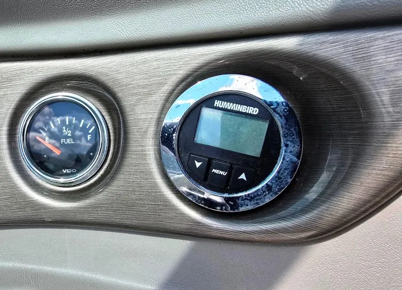 Slide: The Image of Dashboard of a 2008 Bryant 246 BR boat with fuel gauge and Humminbird display. - 15