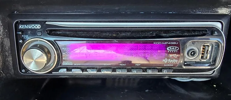 Slide: The Image of Kenwood car stereo in a 2008 Bryant 246 BR boat dashboard. - 16