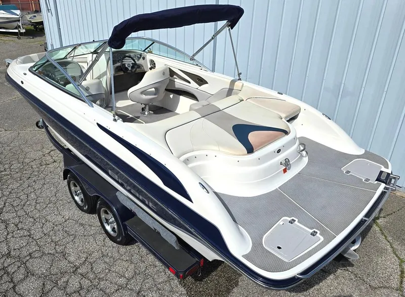 Slide: The Image of 2008 Bryant 246 BR boat on trailer, featuring sleek design and spacious seating. - 2
