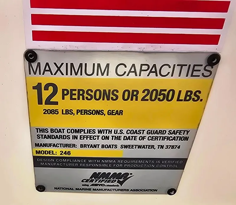 Slide: The Image of Maximum capacity sign for Bryant 246 BR boat, 12 persons or 2050 lbs, NMMA certified. - 21