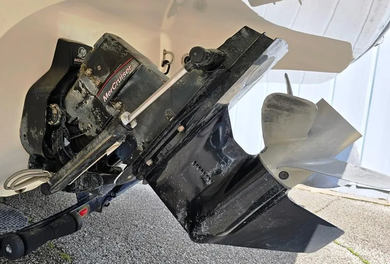 Slide: The Image of 2008 Bryant 246 BR boat with MerCruiser outdrive, showing propeller and lower unit details. - 8