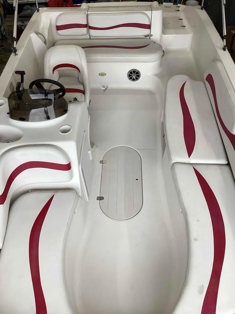 Slide: The Image of 2006 Starcraft SeaStar 2000 boat interior with white and red seating. - 11
