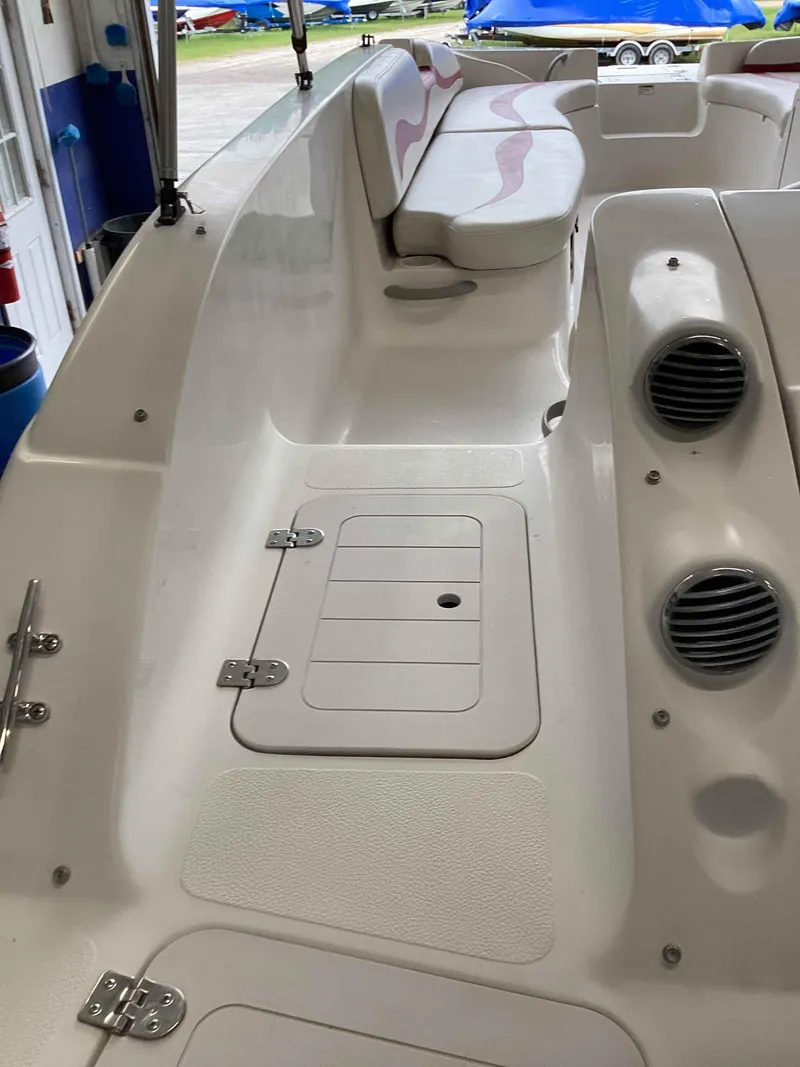 Slide: The Image of 2006 Starcraft SeaStar 2000 boat interior with seating and storage compartments. - 5