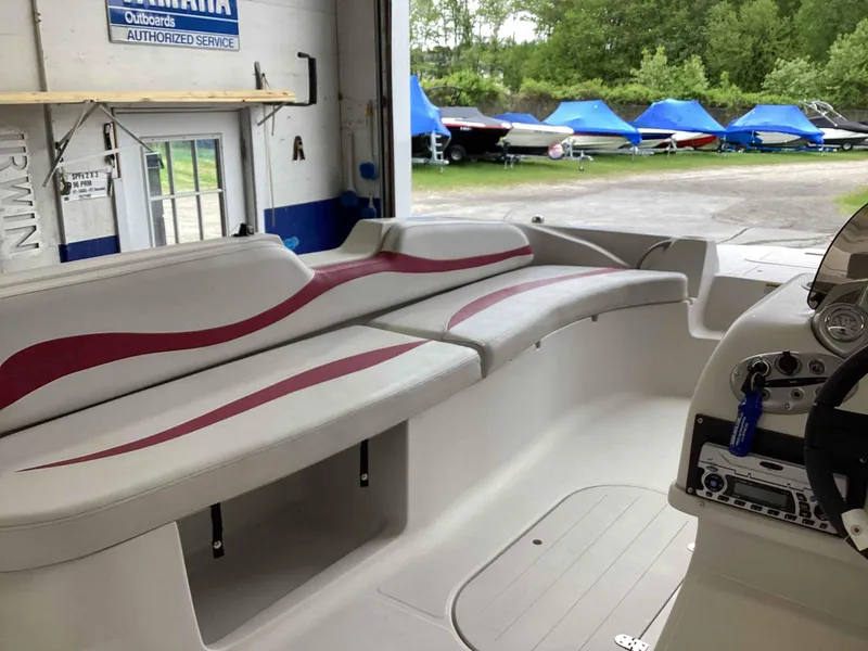 Slide: The Image of Interior of a 2006 Starcraft SeaStar 2000 boat with seating and control panel. - 7