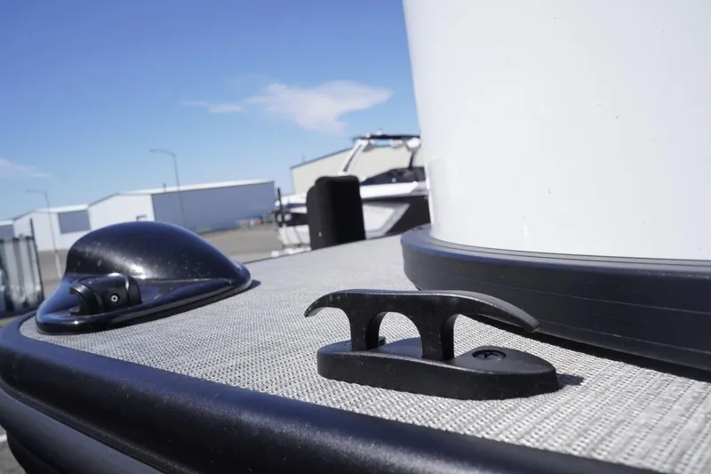 Slide: The Image of 2025 Lowe SS 230 boat deck with cleat and hardware under clear blue sky. - 14