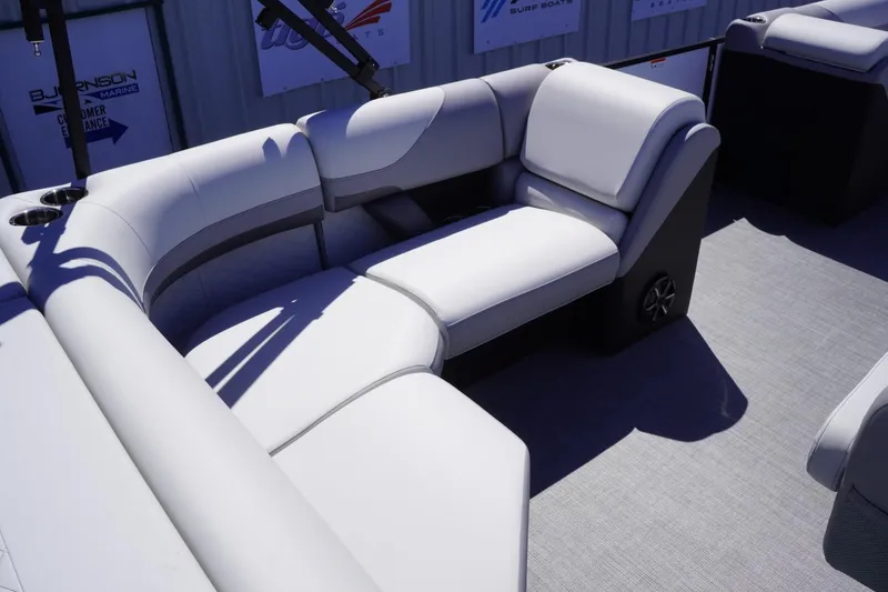 Slide: The Image of 2025 Lowe SS 230 boat interior with plush white seating and modern design. - 18