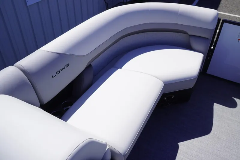 Slide: The Image of 2025 Lowe SS 230 boat interior with curved seating and modern design. - 24