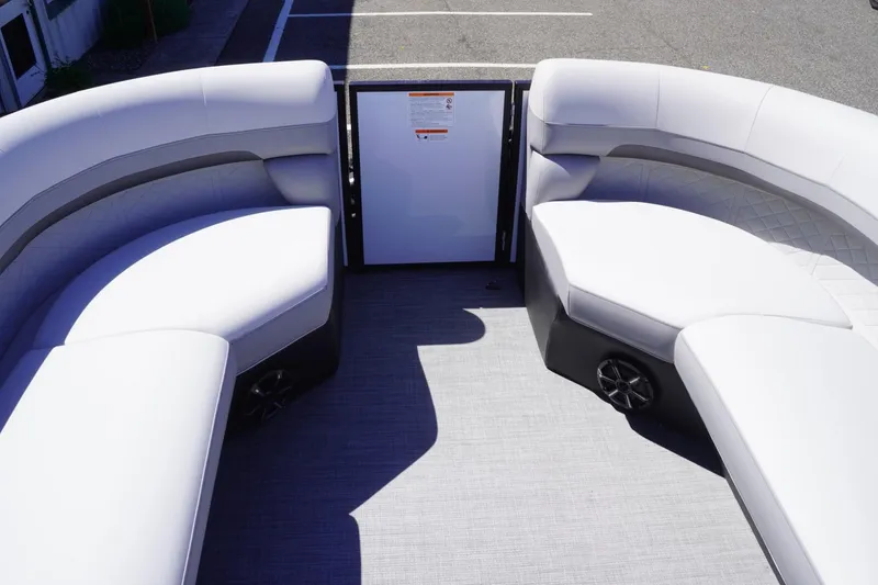 Slide: The Image of 2025 Lowe SS 230 boat interior with white cushioned seating and modern design. - 25