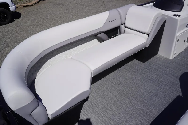 Slide: The Image of 2025 Lowe SS 230 boat interior with sleek, white seating and modern design. - 28