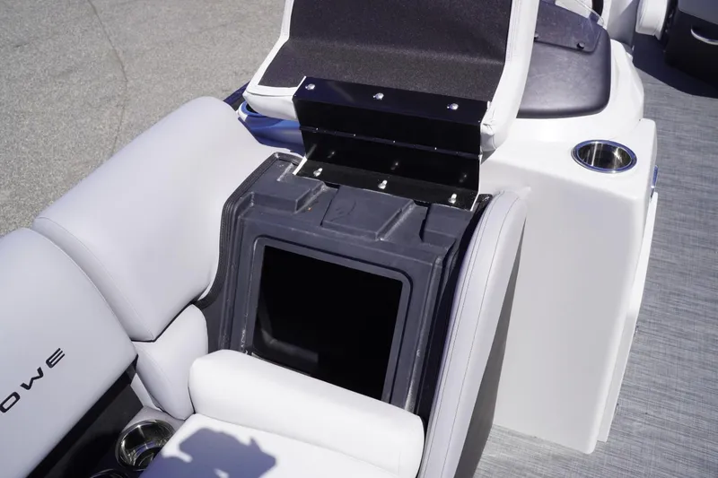 Slide: The Image of 2025 Lowe SS 230 boat interior with open storage compartment and cup holders. - 37