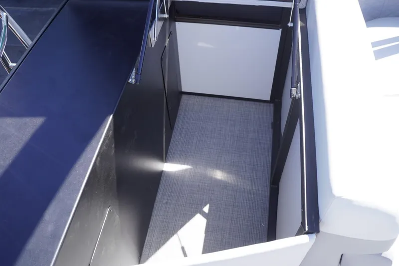 Slide: The Image of Interior view of 2025 Lowe SS 230 boat, featuring sleek design and modern seating. - 40