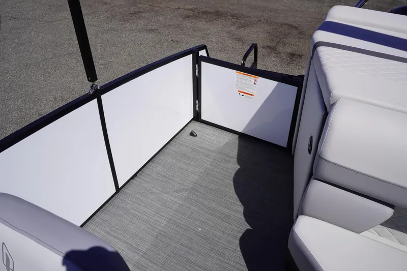 Slide: The Image of 2025 Lowe SS 230 boat interior with white seating and gray flooring. - 43