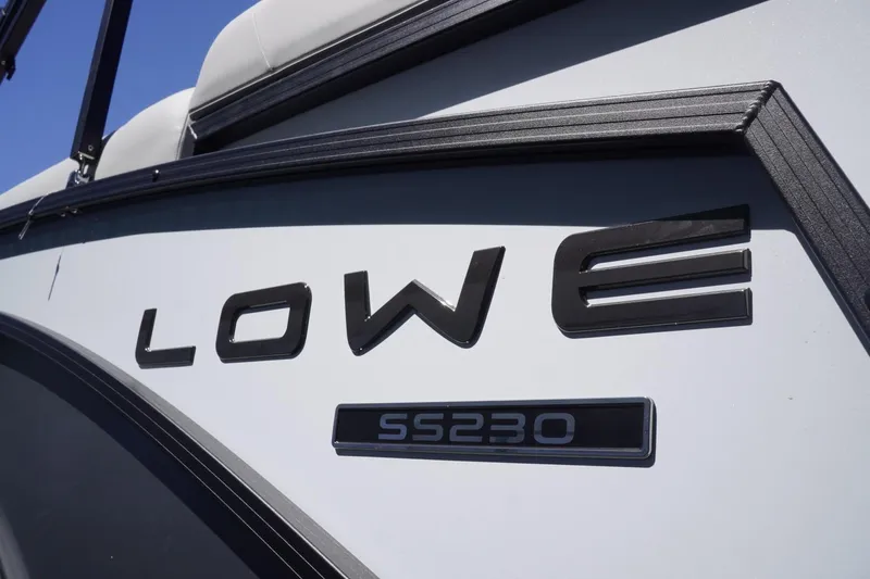 Slide: The Image of 2025 Lowe SS 230 boat logo on side panel, close-up view. - 8