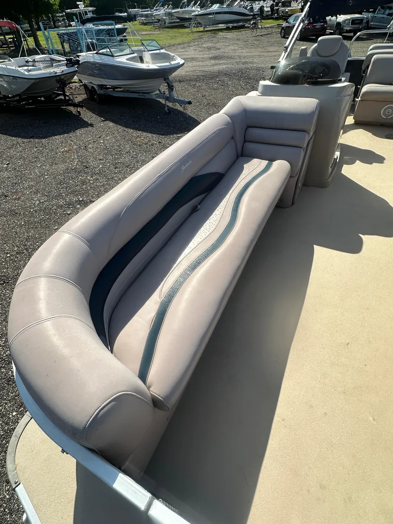 Slide: The Image of 2015 Godfrey Sweetwater 220 Premium Edition boat with spacious seating and modern design. - 11