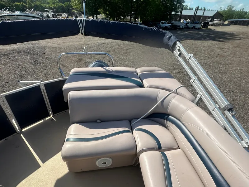 Slide: The Image of 2015 Godfrey Sweetwater 220 Premium Edition boat interior with cushioned seating. - 14