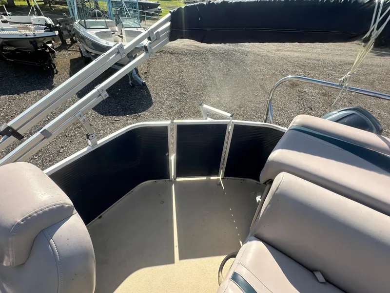 Slide: The Image of 2015 Godfrey Sweetwater 220 Premium Edition boat interior with seating and railing. - 15