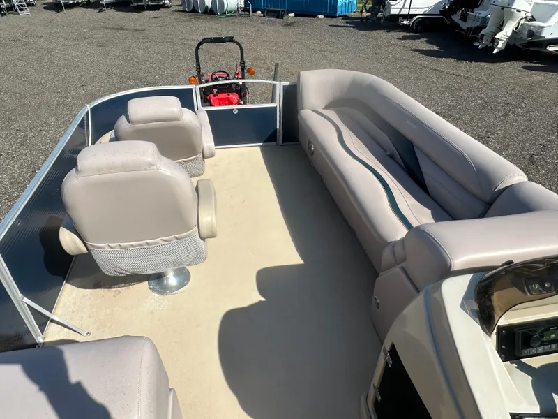 Slide: The Image of 2015 Godfrey Sweetwater 220 Premium Edition pontoon boat interior with seating and controls. - 25