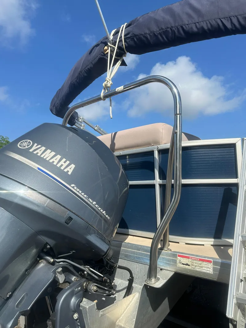 Slide: The Image of 2015 Godfrey Sweetwater 220 boat with Yamaha outboard motor under clear blue sky. - 28