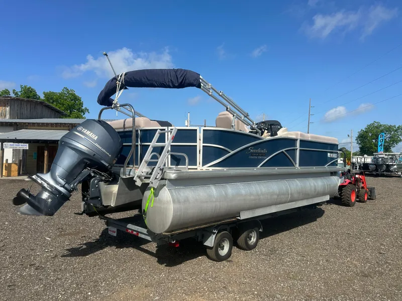 Slide: The Image of 2015 Godfrey Sweetwater 220 Premium Edition pontoon boat on trailer, with Yamaha outboard motor. - 4