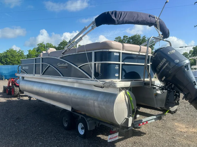 Slide: The Image of 2015 Godfrey Sweetwater 220 Premium Edition pontoon boat on trailer, with Yamaha outboard motor. - 7
