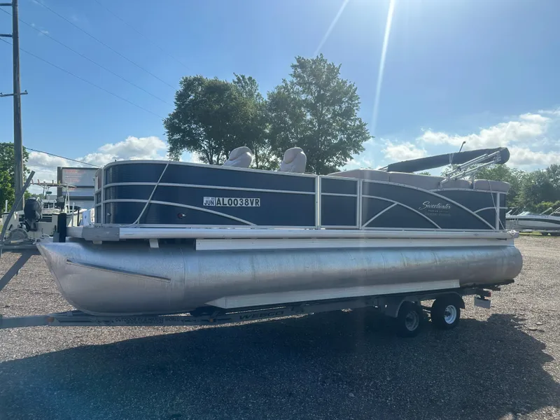 Slide: The Image of 2015 Godfrey Sweetwater 220 Premium Edition pontoon boat on trailer, sunny day. - 9