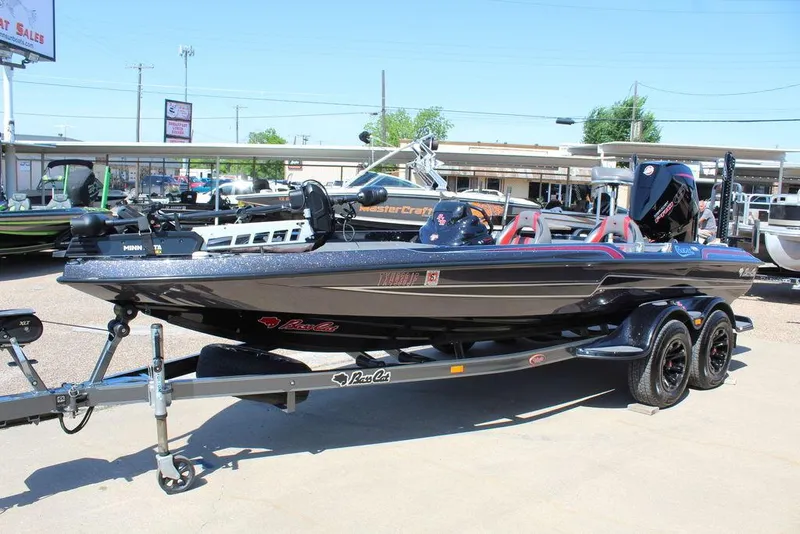 Slide: The Image of 2021 Bass Cat Cougar FTD boat on trailer, parked outdoors. - 11