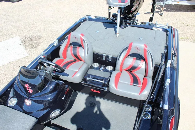 Slide: The Image of 2021 Bass Cat Cougar FTD boat interior with dual seats and steering console. - 14