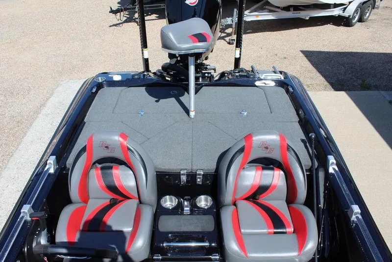 Slide: The Image of 2021 Bass Cat Cougar FTD boat interior with red and gray seats, fishing deck. - 16