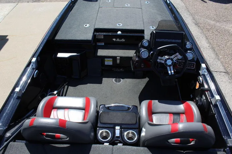 Slide: The Image of 2021 Bass Cat Cougar FTD boat interior with dual seats and advanced dashboard controls. - 18