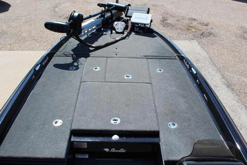 Slide: The Image of 2021 Bass Cat Cougar FTD boat deck with Garmin equipment and storage compartments. - 20