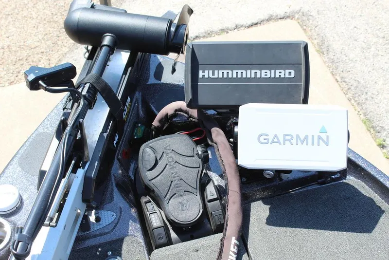 Slide: The Image of 2021 Bass Cat Cougar FTD boat with Humminbird and Garmin navigation systems. - 23