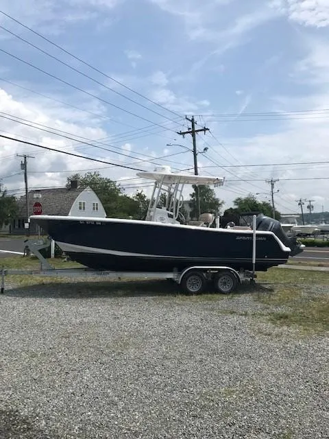 Slide: The Image of 2020 Sportsman Open 232 Center Console boat on trailer, parked outdoors. - 3