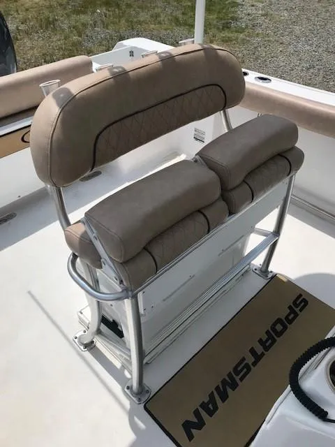 Slide: The Image of 2020 Sportsman Open 232 Center Console boat seating with cushioned bench and stainless steel frame. - 8